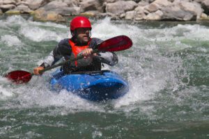 Erik Weihenmayer shooting the Colorado River Rapids